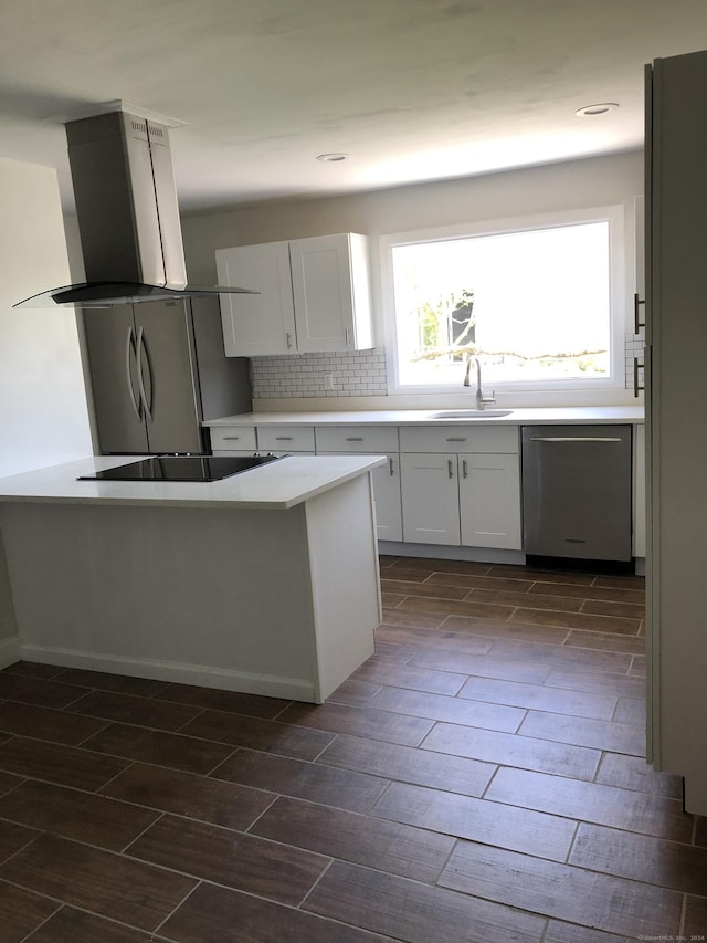 kitchen featuring sink, dark wood-type flooring, stainless steel dishwasher, island exhaust hood, and white cabinets