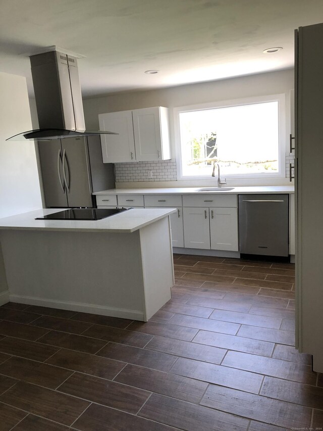 86 Vanguard St, Bridgeport, CT 06606 - kitchen featuring island range hood, dishwasher, wood tiled floors, black electric stovetop, and white cabinetry