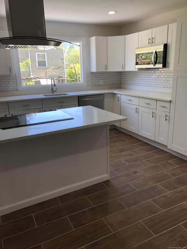 86 Vanguard St, Bridgeport, CT 06606 - kitchen with stainless steel appliances, backsplash, island exhaust hood, dark wood finished floors, and white cabinetry