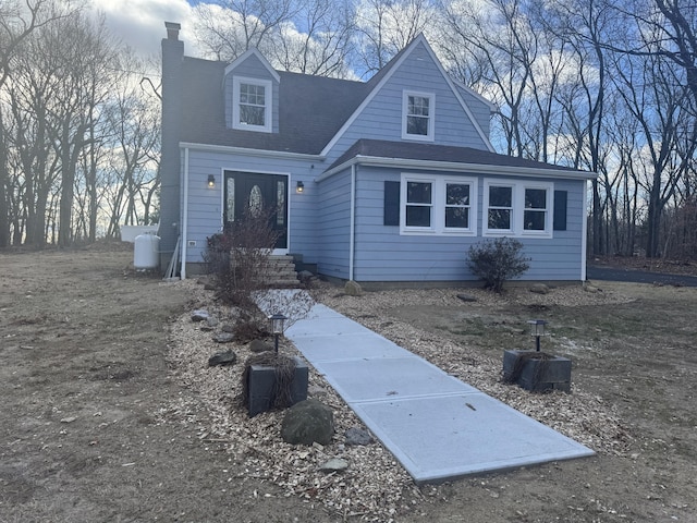 view of new england style home