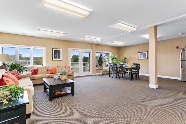 living room with carpet floors and french doors