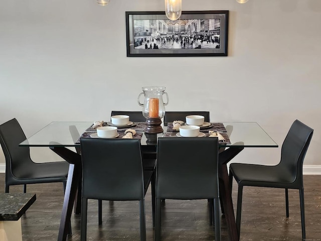 dining space with dark hardwood / wood-style floors