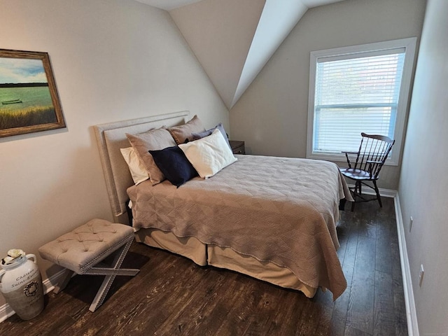 bedroom with dark wood-type flooring and vaulted ceiling