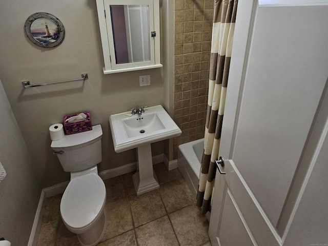 full bathroom with tile patterned floors, toilet, sink, and shower / tub combo