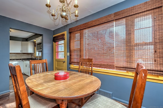 dining area featuring an inviting chandelier