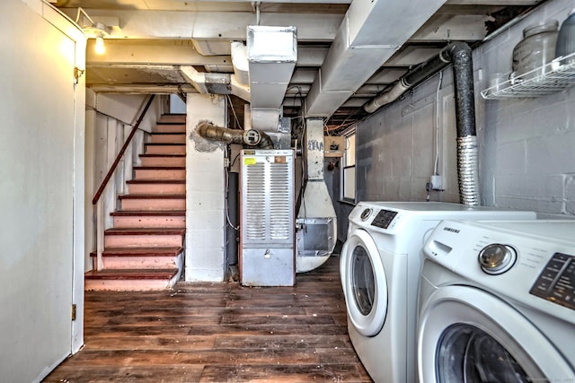 laundry room featuring dark hardwood / wood-style floors and washing machine and clothes dryer