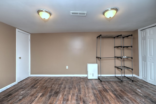 empty room with dark hardwood / wood-style floors