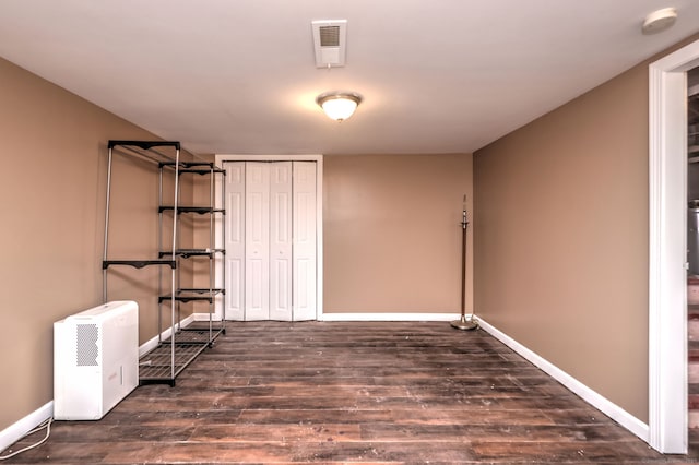 basement featuring dark wood-type flooring