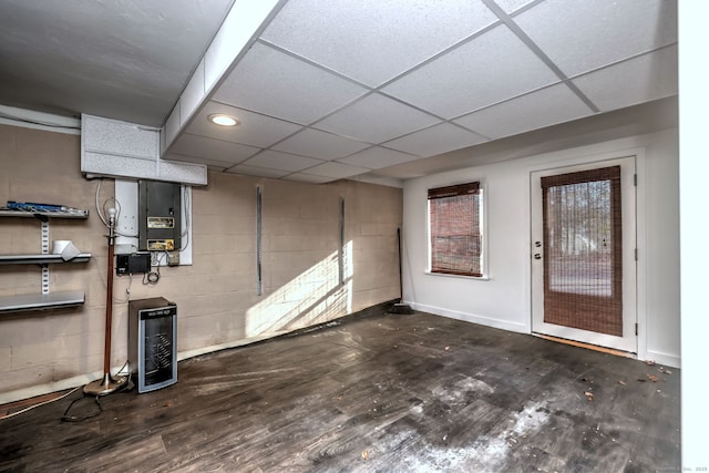 basement with a paneled ceiling