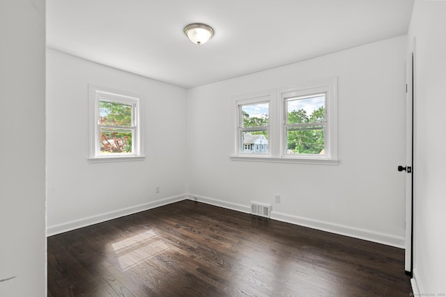 empty room featuring dark hardwood / wood-style floors