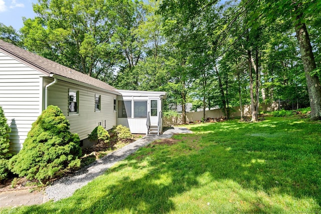 view of yard featuring a sunroom