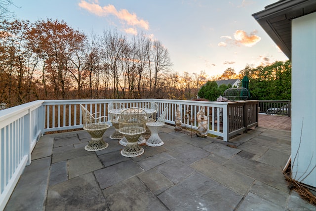 view of patio terrace at dusk