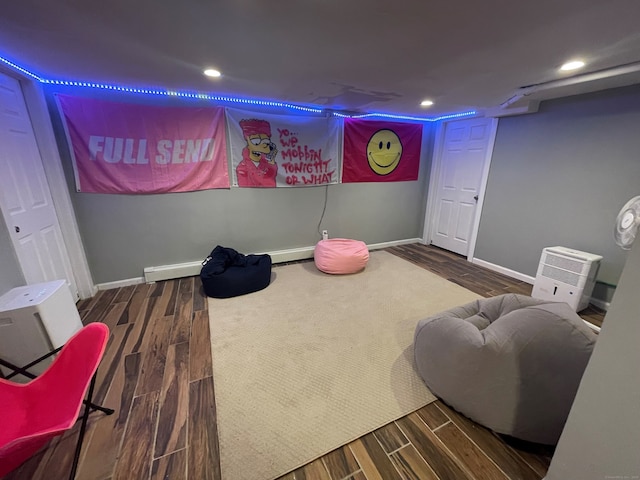 recreation room with dark wood-type flooring