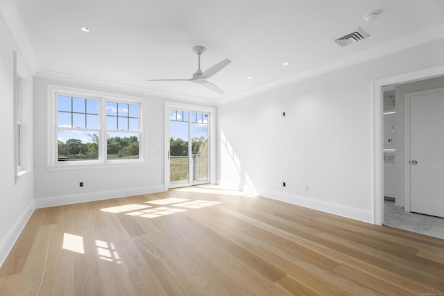 unfurnished living room with ceiling fan, light wood-type flooring, and ornamental molding