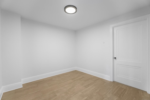 unfurnished room with light hardwood / wood-style floors