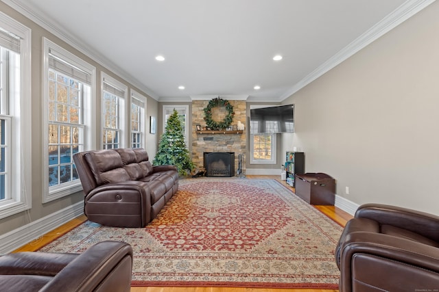 living room featuring hardwood / wood-style floors, plenty of natural light, and ornamental molding