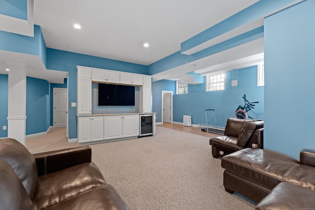 living room featuring light carpet and beverage cooler