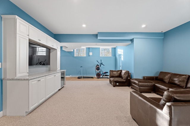 living room with wine cooler and light carpet