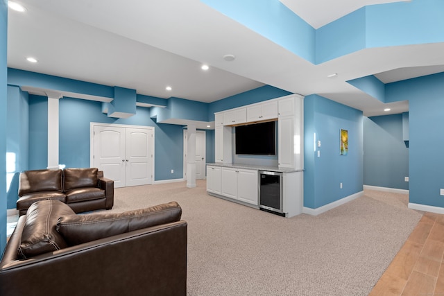 living room featuring light hardwood / wood-style flooring and wine cooler