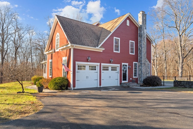 view of side of home featuring a garage