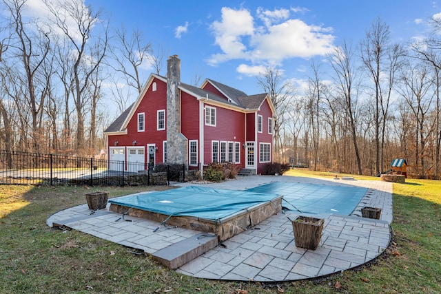 view of pool featuring a yard