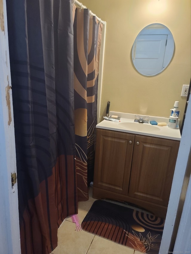 bathroom with tile patterned floors and vanity