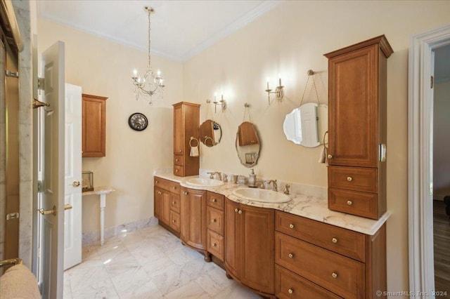 bathroom featuring vanity, crown molding, and an inviting chandelier