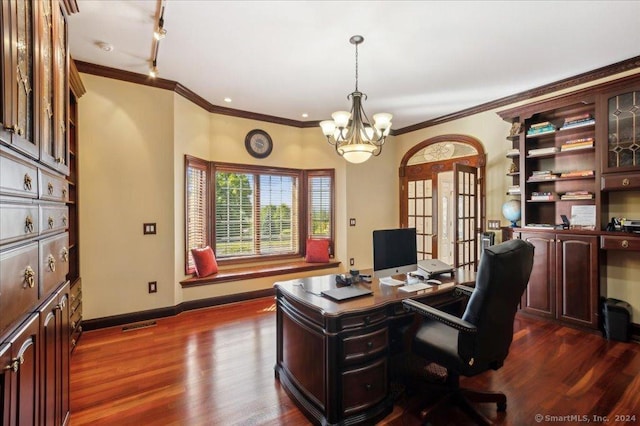 office with dark hardwood / wood-style flooring, crown molding, rail lighting, and a chandelier