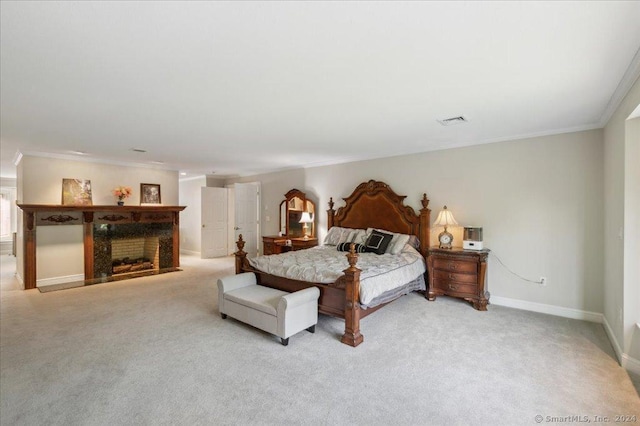 carpeted bedroom with ornamental molding