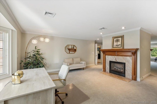 carpeted office featuring ornamental molding and a premium fireplace