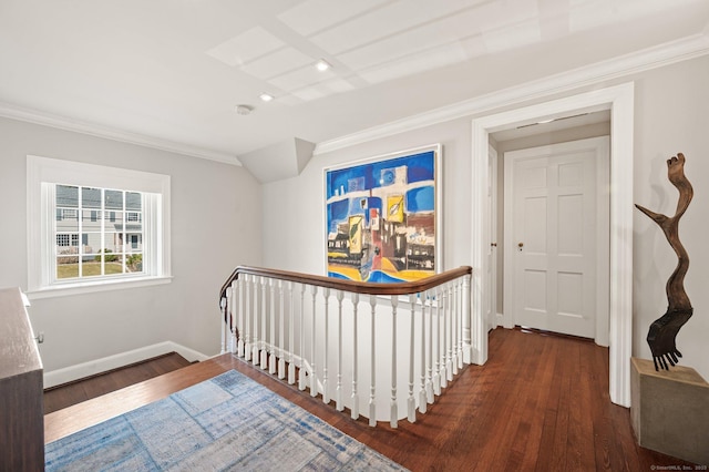 hall featuring ornamental molding, dark wood-type flooring, an upstairs landing, and baseboards