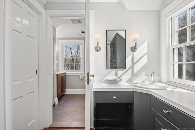 bathroom featuring visible vents, vanity, and baseboards