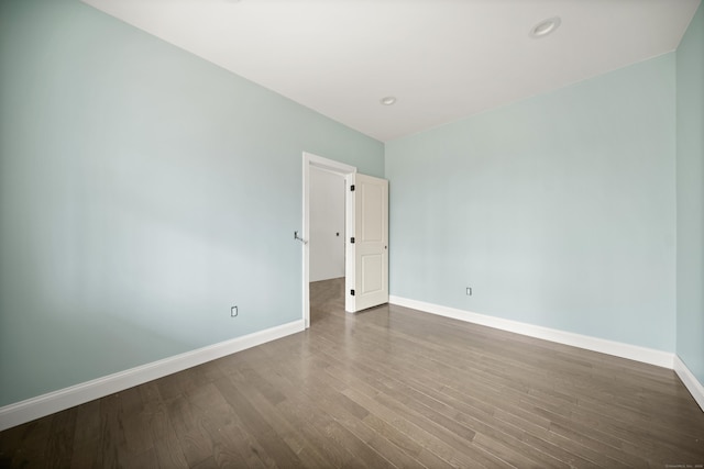 empty room featuring hardwood / wood-style floors