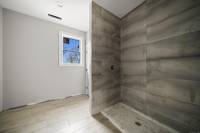 bathroom with tiled shower