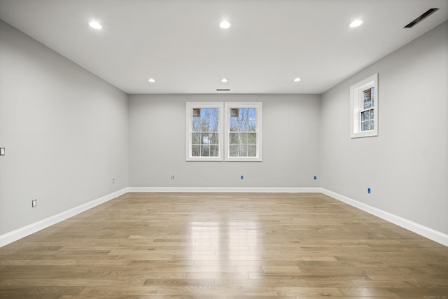 unfurnished room with light wood-type flooring