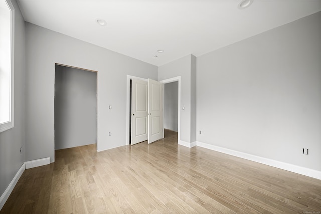 unfurnished bedroom with light hardwood / wood-style floors