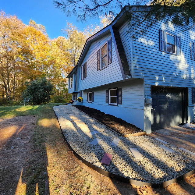 view of property exterior with a garage