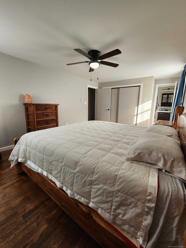 bedroom featuring ceiling fan, a closet, and dark wood-type flooring