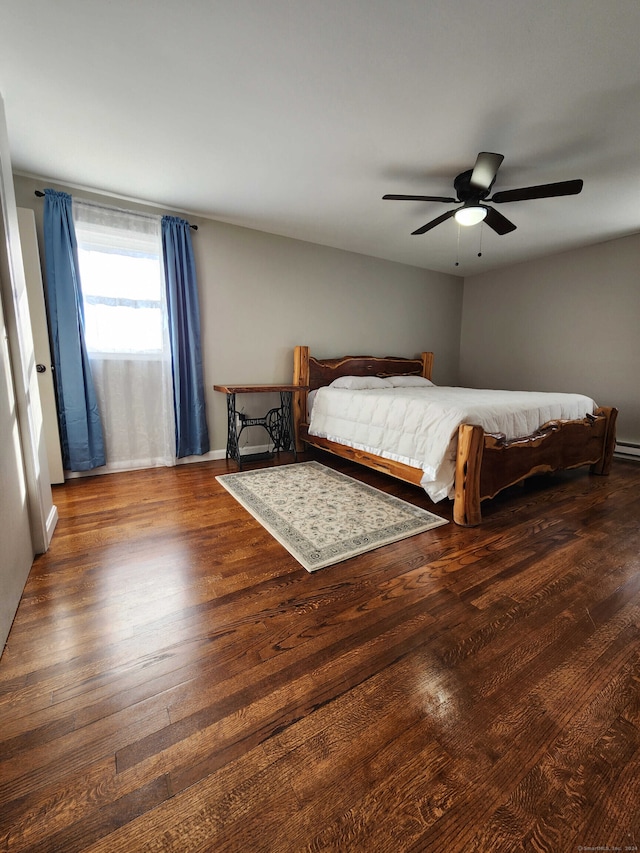 unfurnished bedroom with dark hardwood / wood-style flooring and ceiling fan