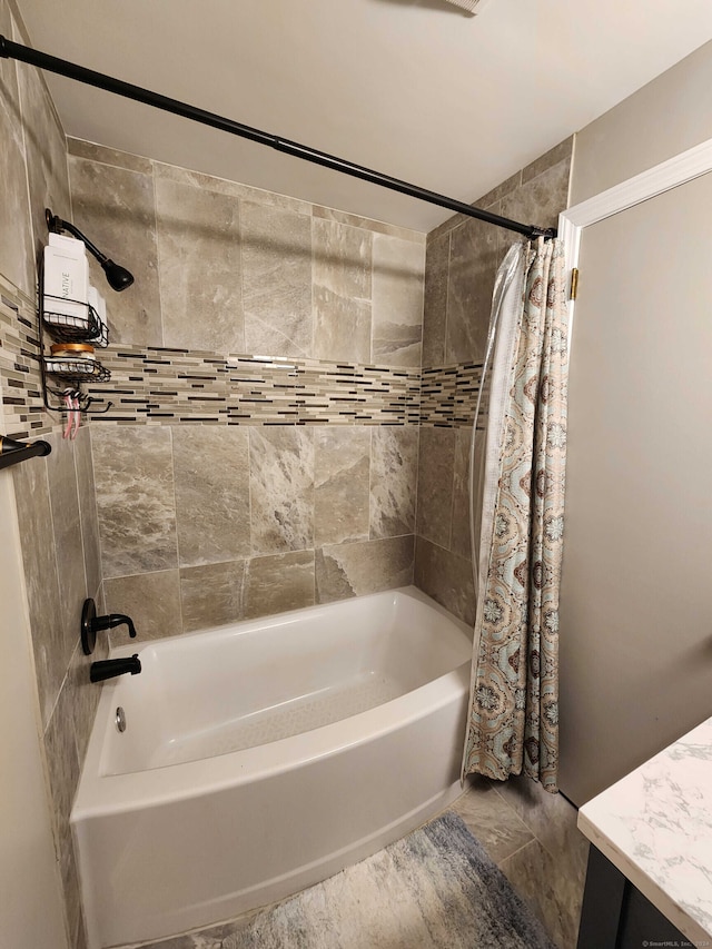 bathroom with tile patterned flooring and shower / bath combination with curtain