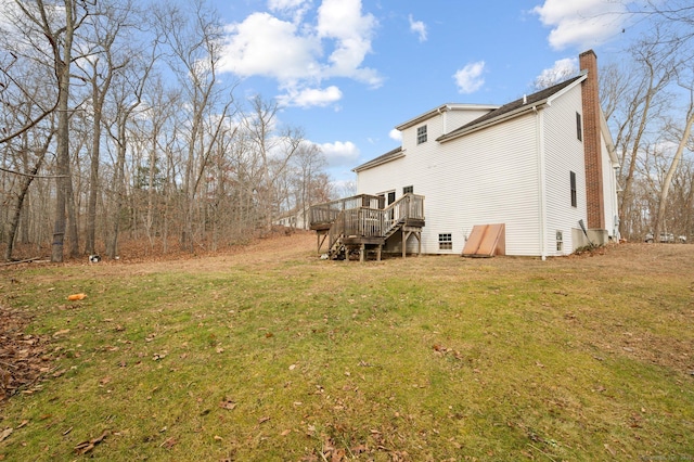 back of house featuring a yard and a deck