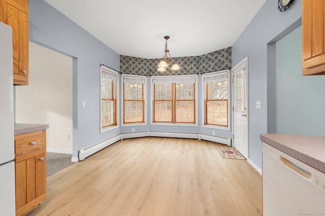 unfurnished dining area with light wood-type flooring