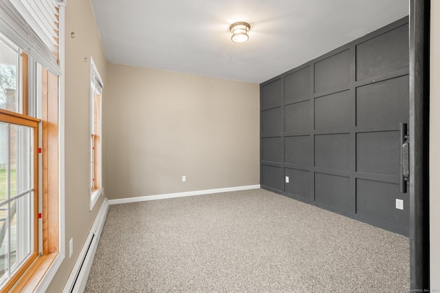 unfurnished room featuring carpet and a wealth of natural light