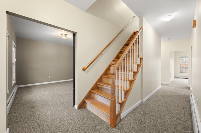 stairway featuring carpet floors and a baseboard radiator