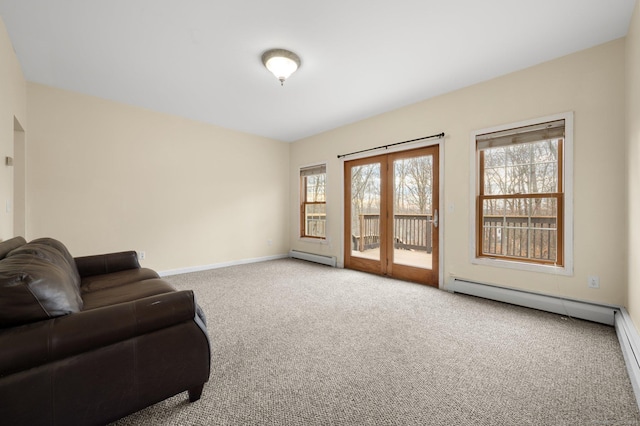 sitting room featuring carpet flooring and a baseboard radiator