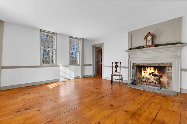 unfurnished living room with wood-type flooring