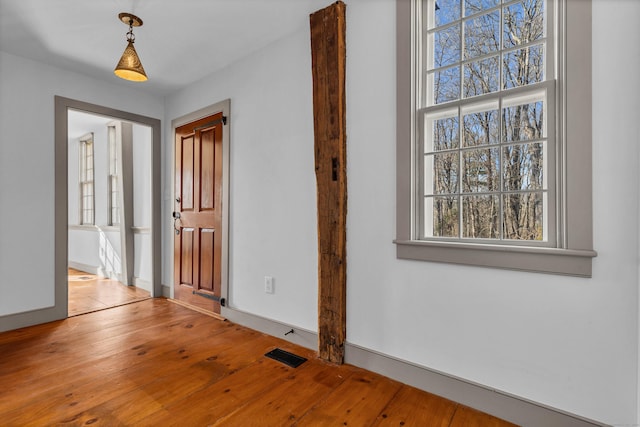 empty room with light hardwood / wood-style floors