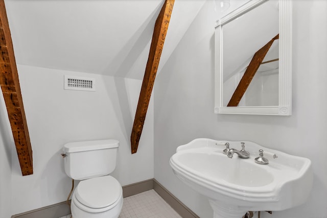 bathroom with sink, tile patterned flooring, and toilet