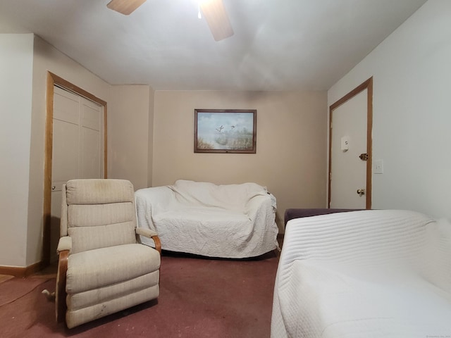 carpeted bedroom with ceiling fan and a closet