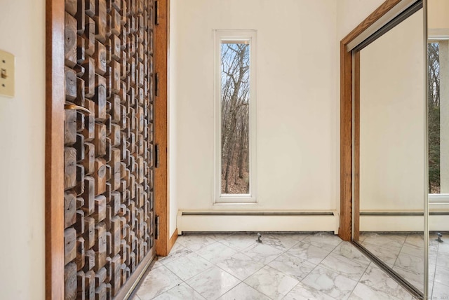 bathroom featuring baseboard heating